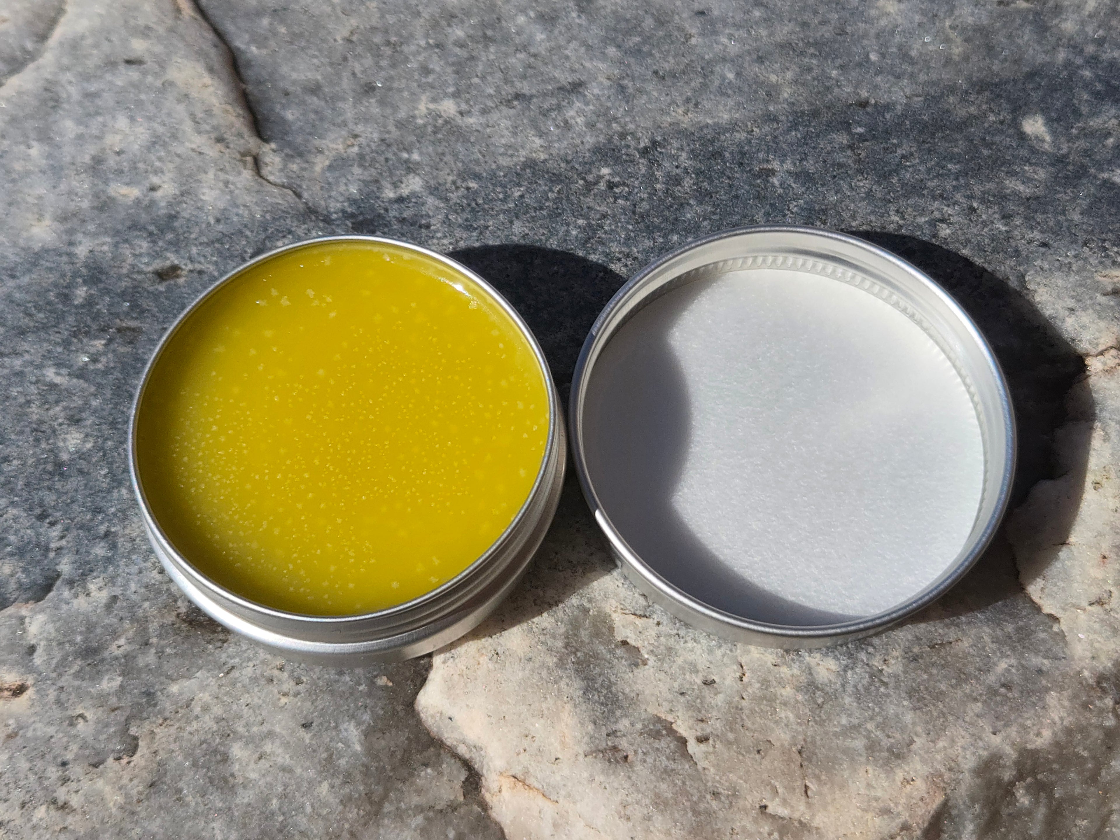 Open 1oz OG Wild Desert Glow Salve showing natural honey-infused balm texture to nourish and heal skin