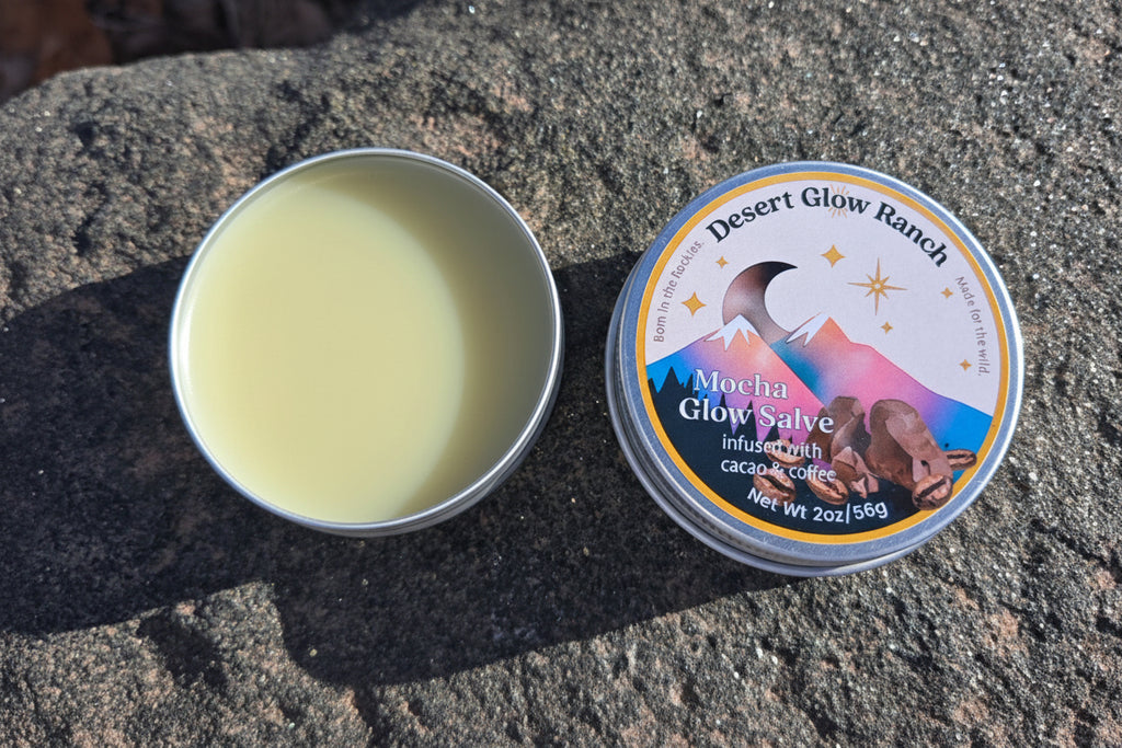 Mocha glow salve organic coffee and chocolate moisturizer 2 oz tin open and closed on natural rock surface