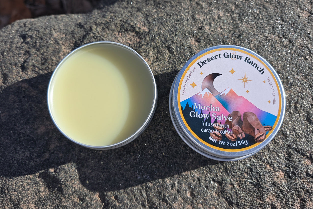 Mocha glow salve organic coffee and chocolate moisturizer 2 oz tin open and closed on natural rock surface